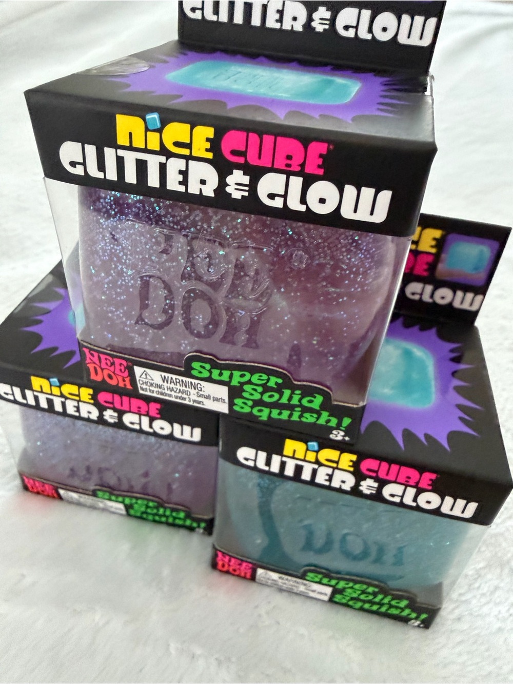 Set of Needoh Nice Cube Glitter & Glow Squishy Toys - Purple and Blue